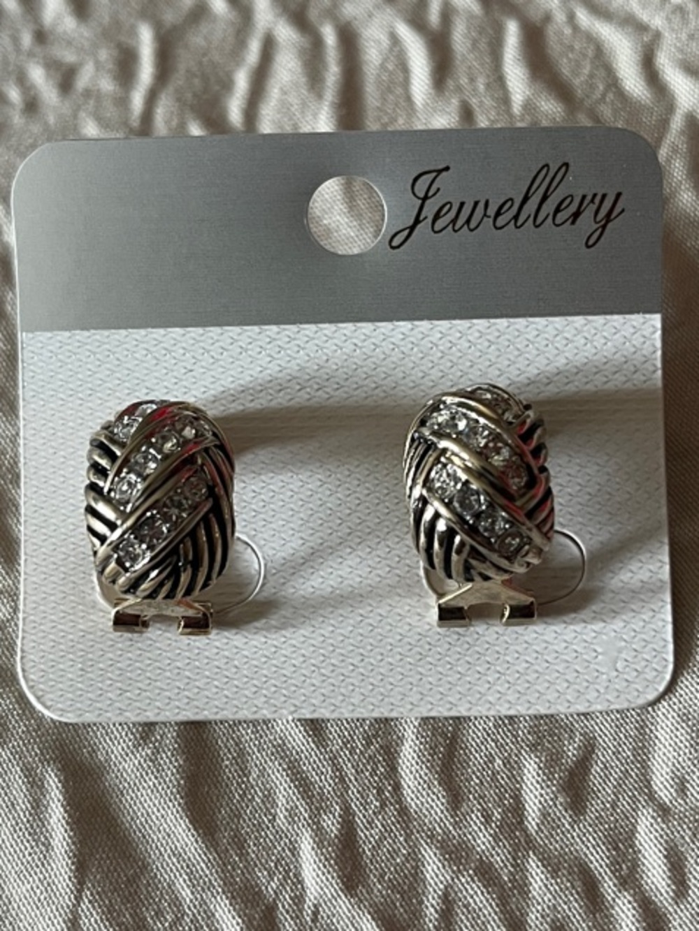 Silver Tone Knotted Earrings with Rhinestones
